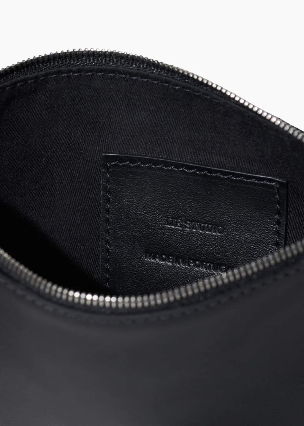 LIÉ Studio Charlie Clutch in Black | Shop Tula