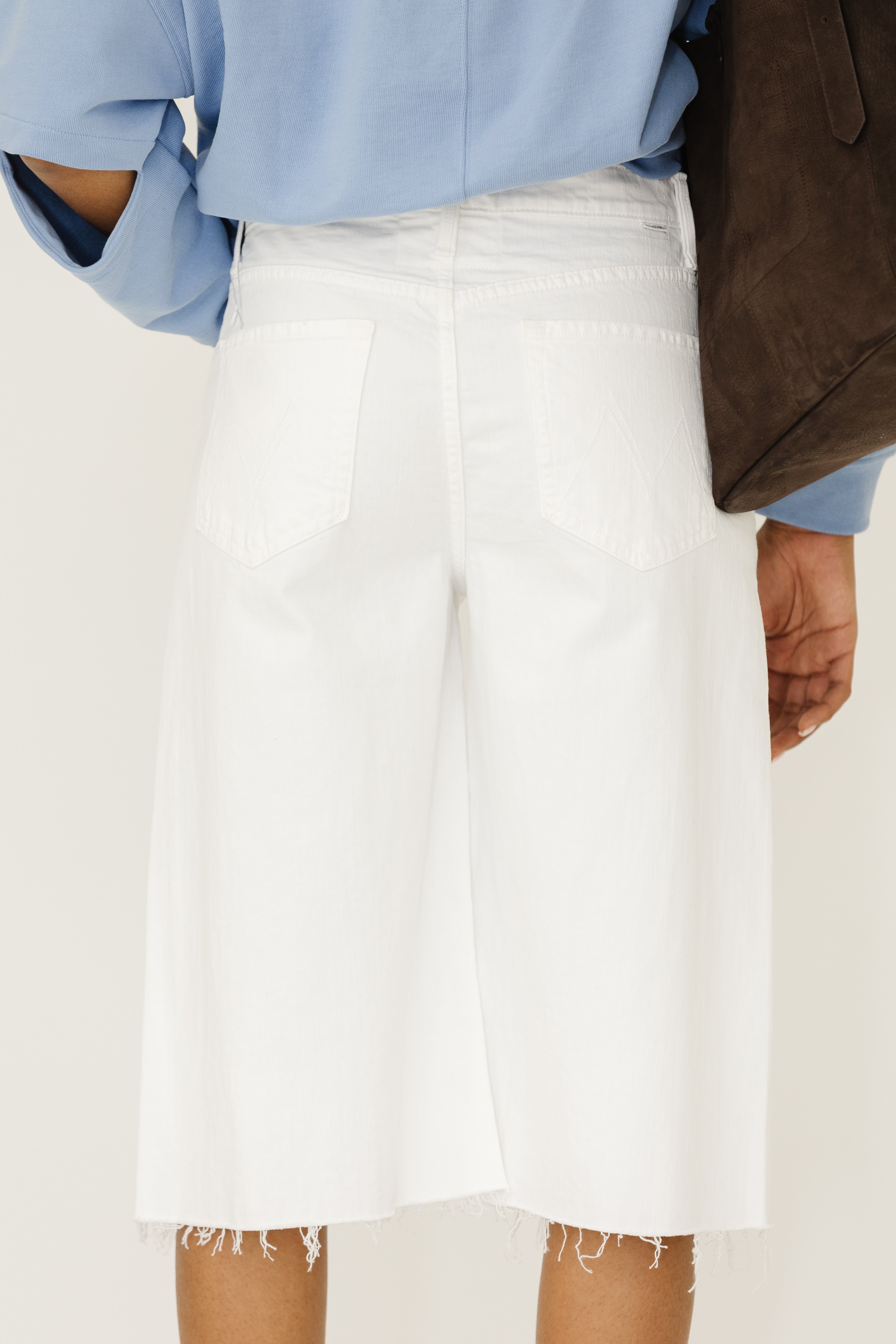 MOTHER Denim The Whole Lot Zip Twist Fray Shorts in Totally Innocent | Shop Tula