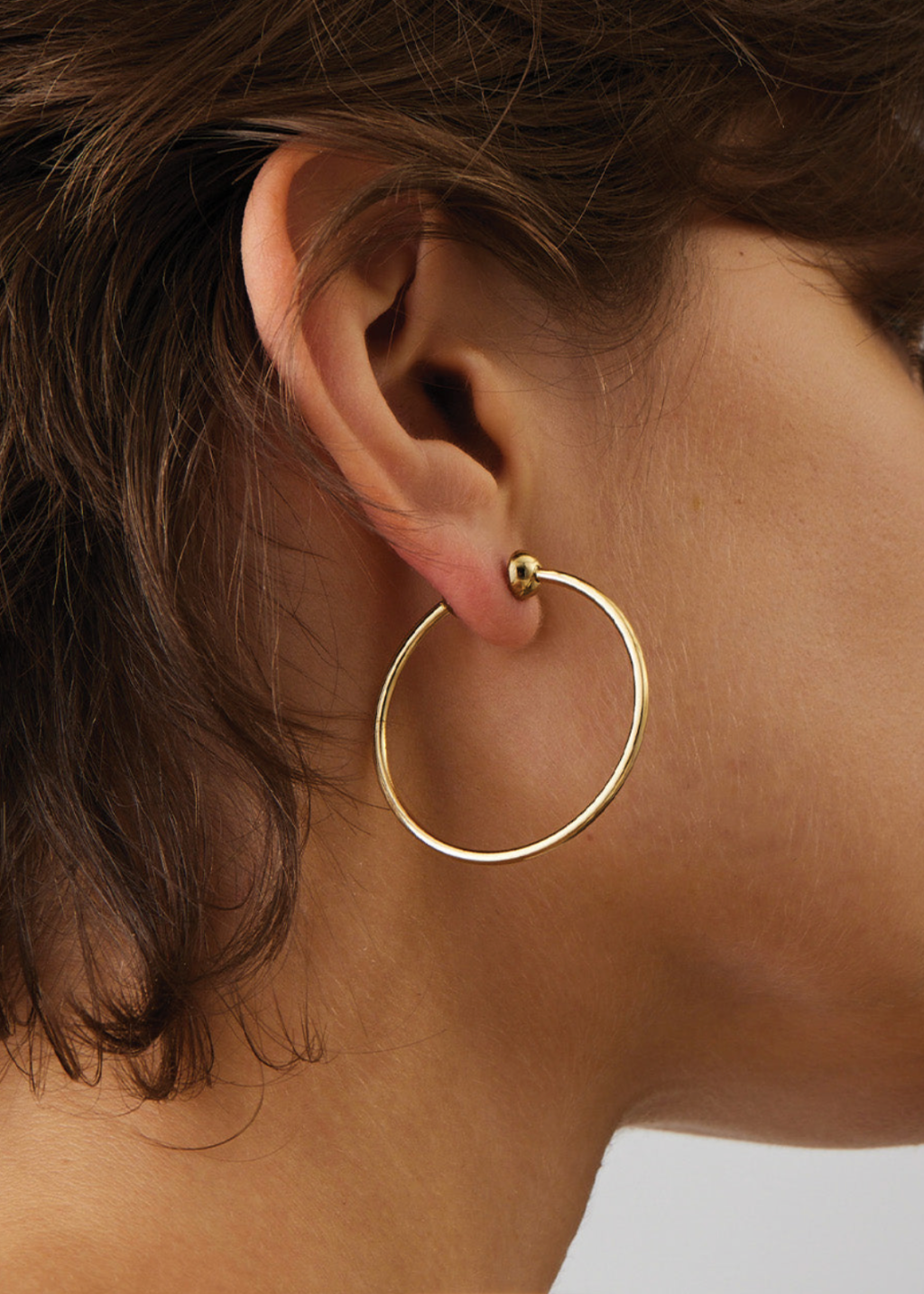 Jenny Bird Small Icon Hoops in Gold Model | Tula's Online Boutique