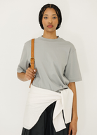 Tibi Mock Neck Unisex T-Shirt in Pumice | Shop Tula